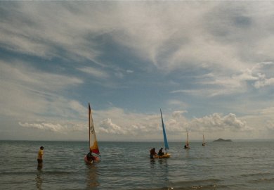 Novice sailors trying single-handed sailing for the first time at the end of a training course run by the club